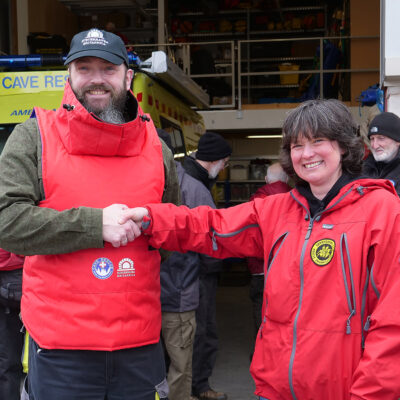 Beth Knight (right), Derbyshire CRO, constructor of the casualty bags and rescue jackets, with Phil Catling, SubBrit, showcasing the new BCRC casualty jacket.