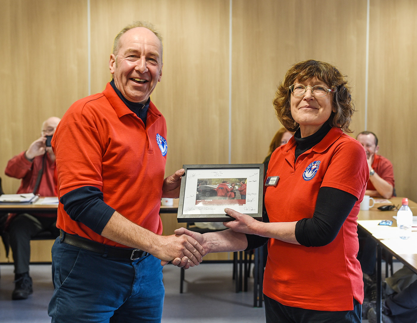 Heather (right) receiving the photograph from BCRC Chair Peter Dennis 